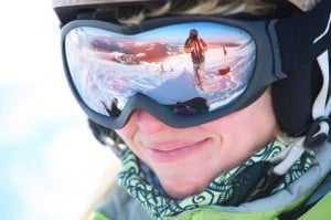 17009073 - closeup portrait of a female skier standing on a skiing slope