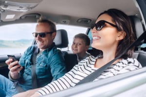 Happy family riding in a car