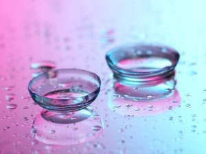 16277170 - contact lenses, on pink-blue background